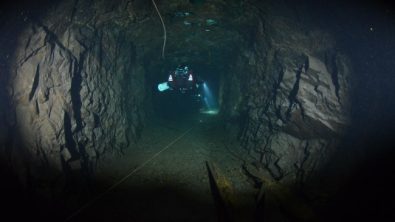 Diving down one of the many passages.