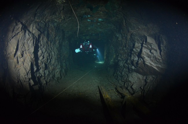 Diving down one of the many passages.