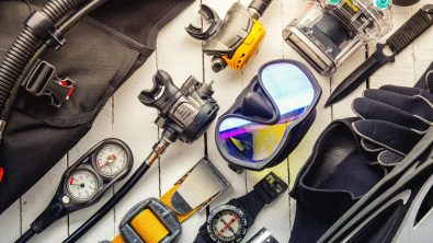 selection of diving accessories laid out on a table