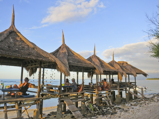 beach huts for eating on the beach in the Gili Islands, Indonesia