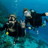 two divers looking at the camera underwater