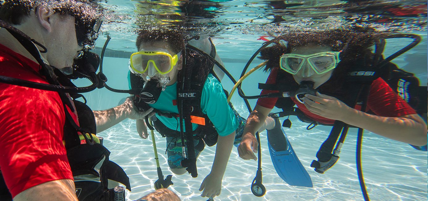 Por qué deberías ser compañero de buceo de tus hijos