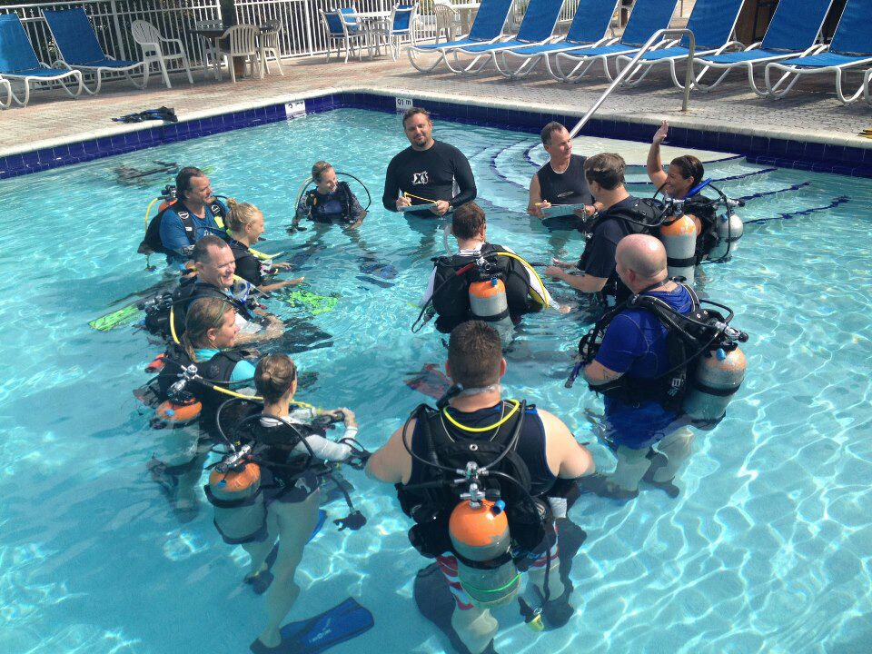 A circle of students and a PADI Instructor