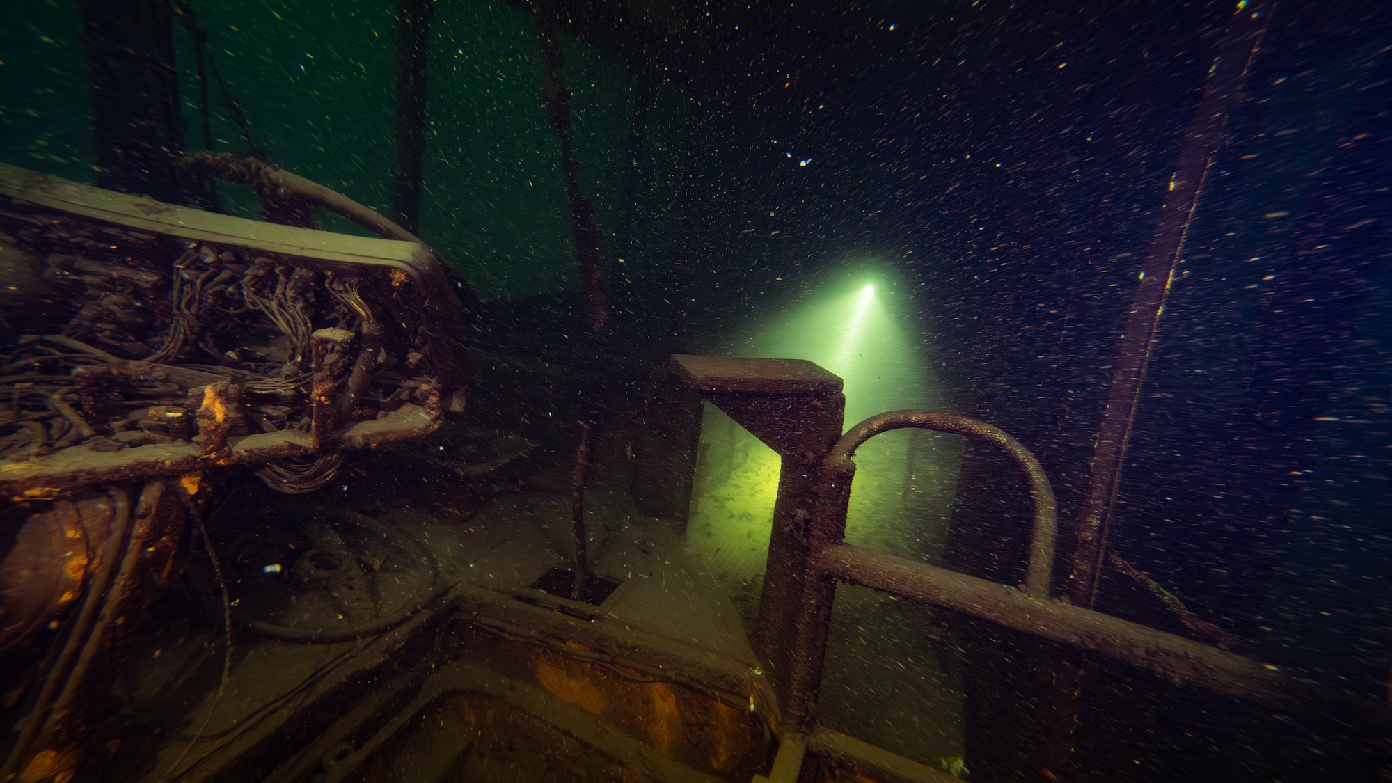 scuba diver exploring wreck in lake uk