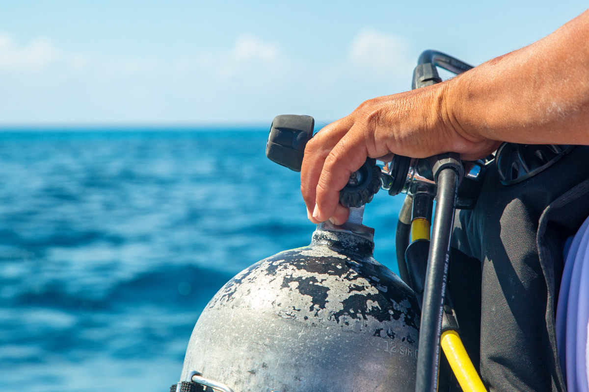 Scuba diver setting up his scuba equipment.