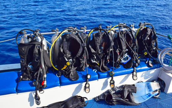 Scuba gear secured on a dive boat.