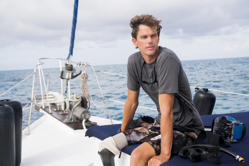 Mike Coots in the Bahamas diving with tiger sharks