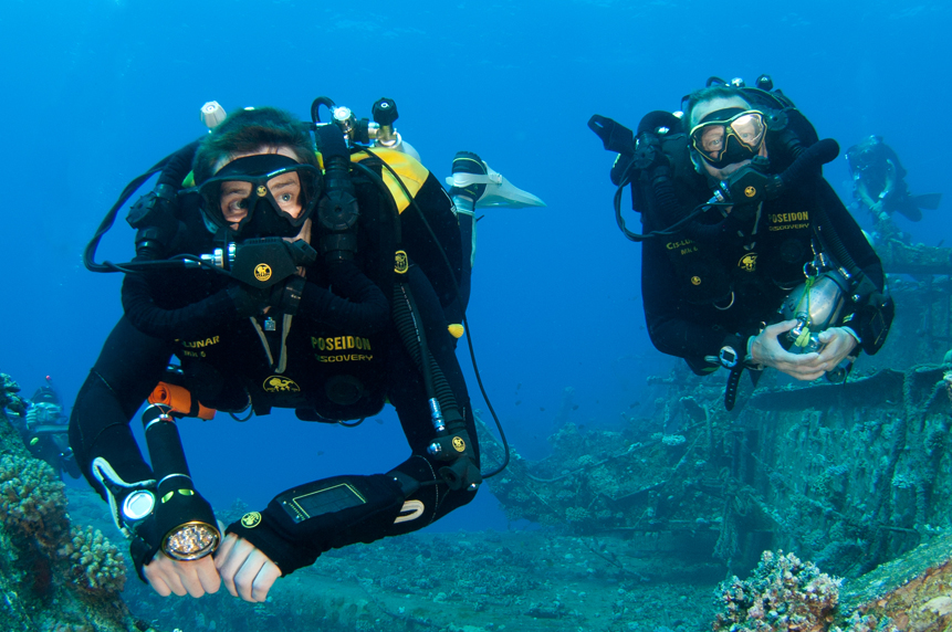 Technical Diving - Rebreather divers exploring a wreck