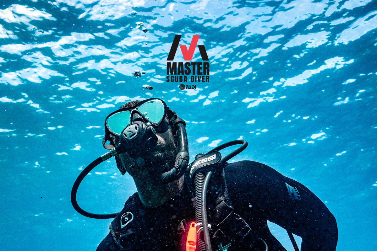 Close up image of scuba diver and display of Master Scuba Diver logo.