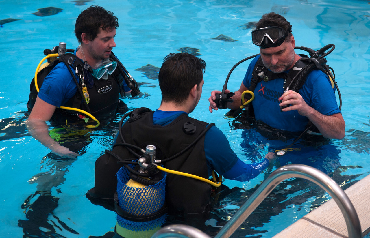 Chris and Gary help Colin with his pre-dive checks