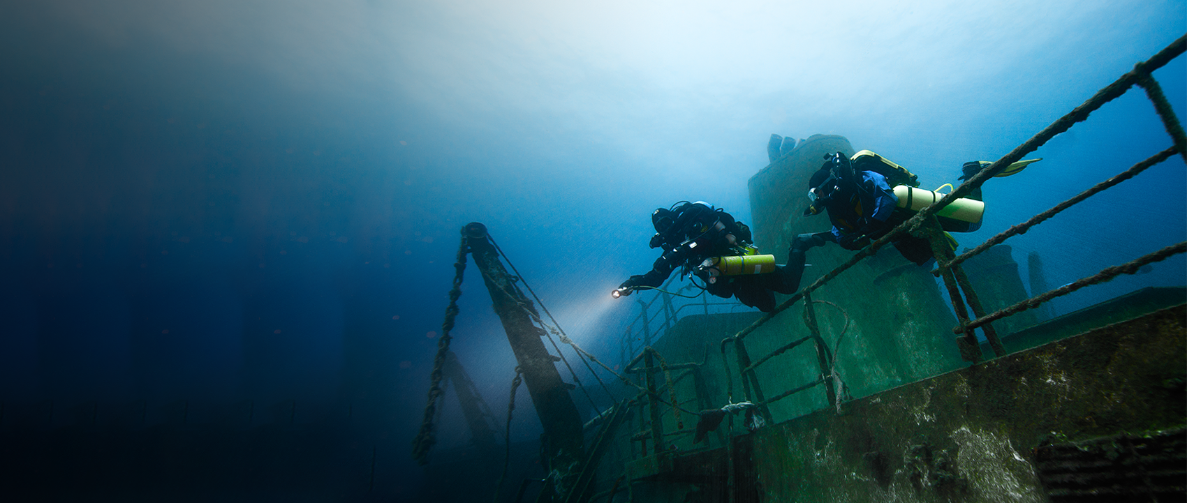 Rebreather divers exploring a wreck