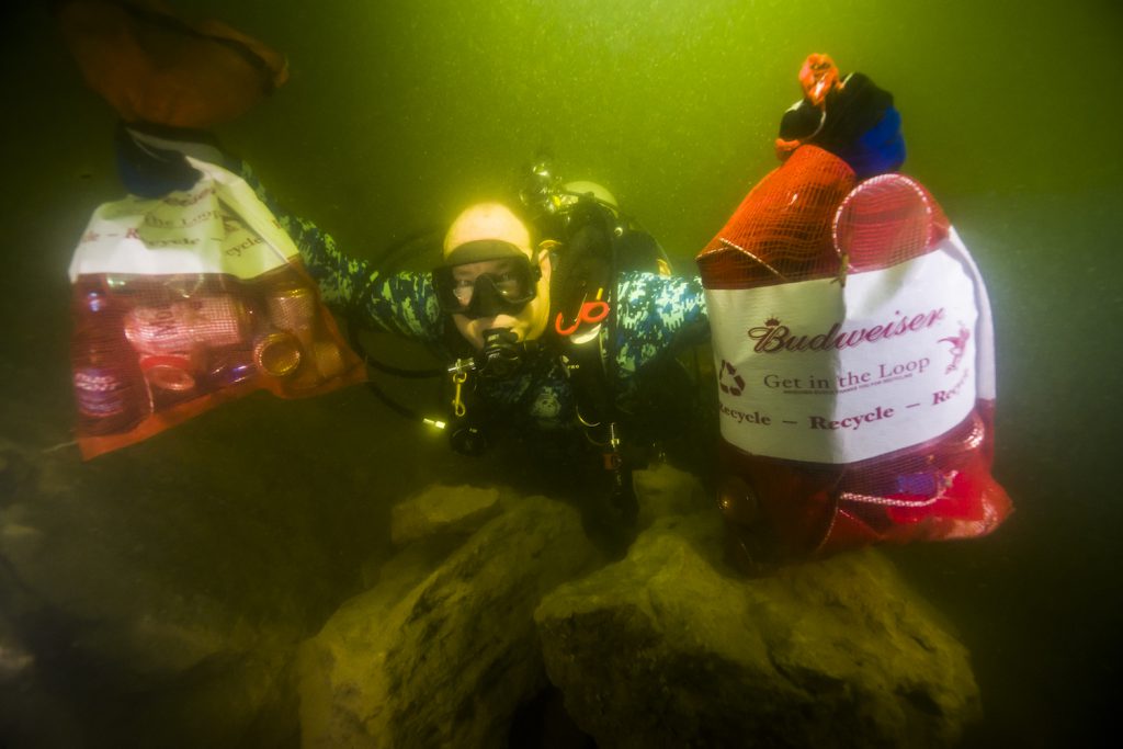 Ed Sailor collects trash during the Lake Travis Underwater Cleanup. Photo: Jennifer Idol 