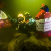 Ed Sailor collects trash during the Lake Travis Underwater Cleanup. Photo: Jennifer Idol
