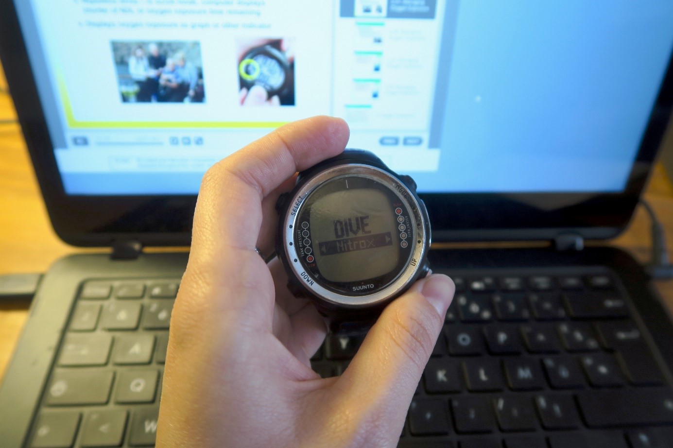 A diver plans a nitrox dive using their dive computer, as poor planning is one of many possible decompression sickness causes