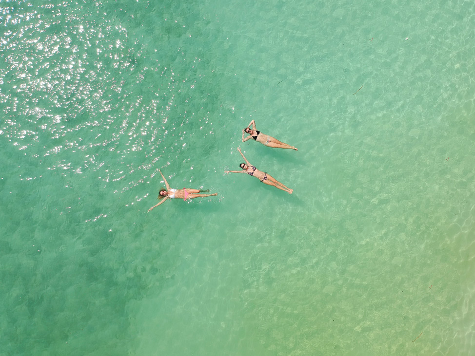 alex baackes dive and yoga retreat
three women floating in tropical waters