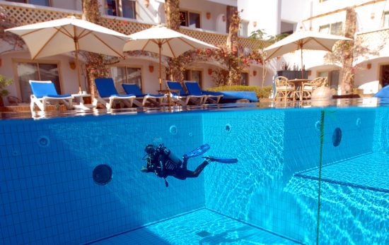 a diver a pool at camel resort