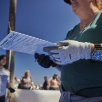 volunteer taking dive against debris data