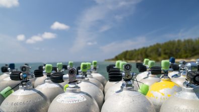 a collection of scuba tanks