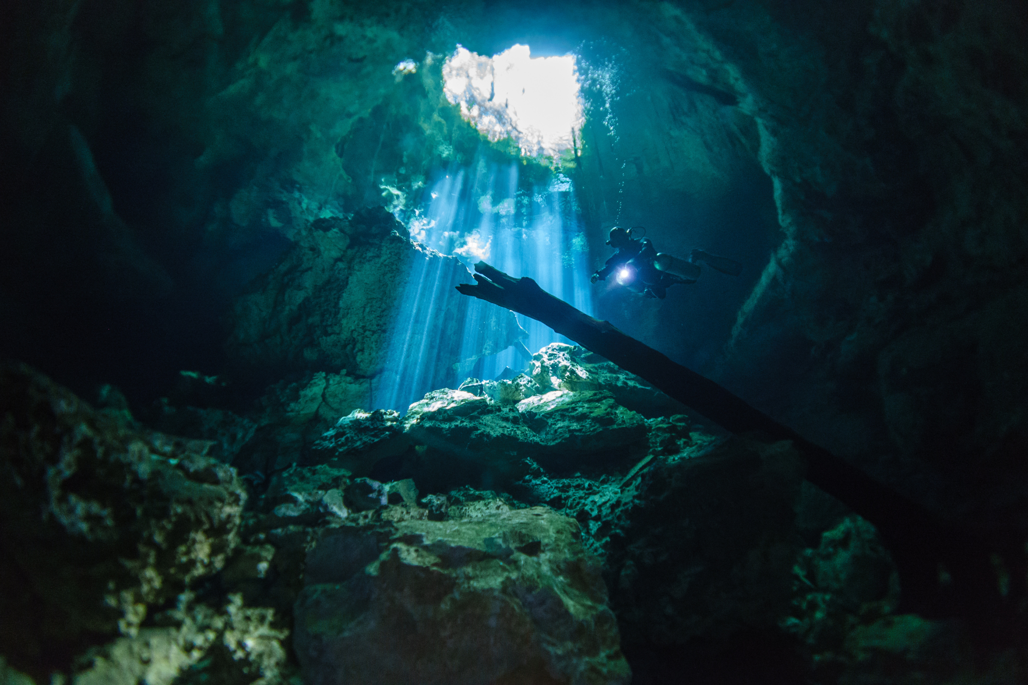 Sidemount diver exploring a Cenote in Mexico