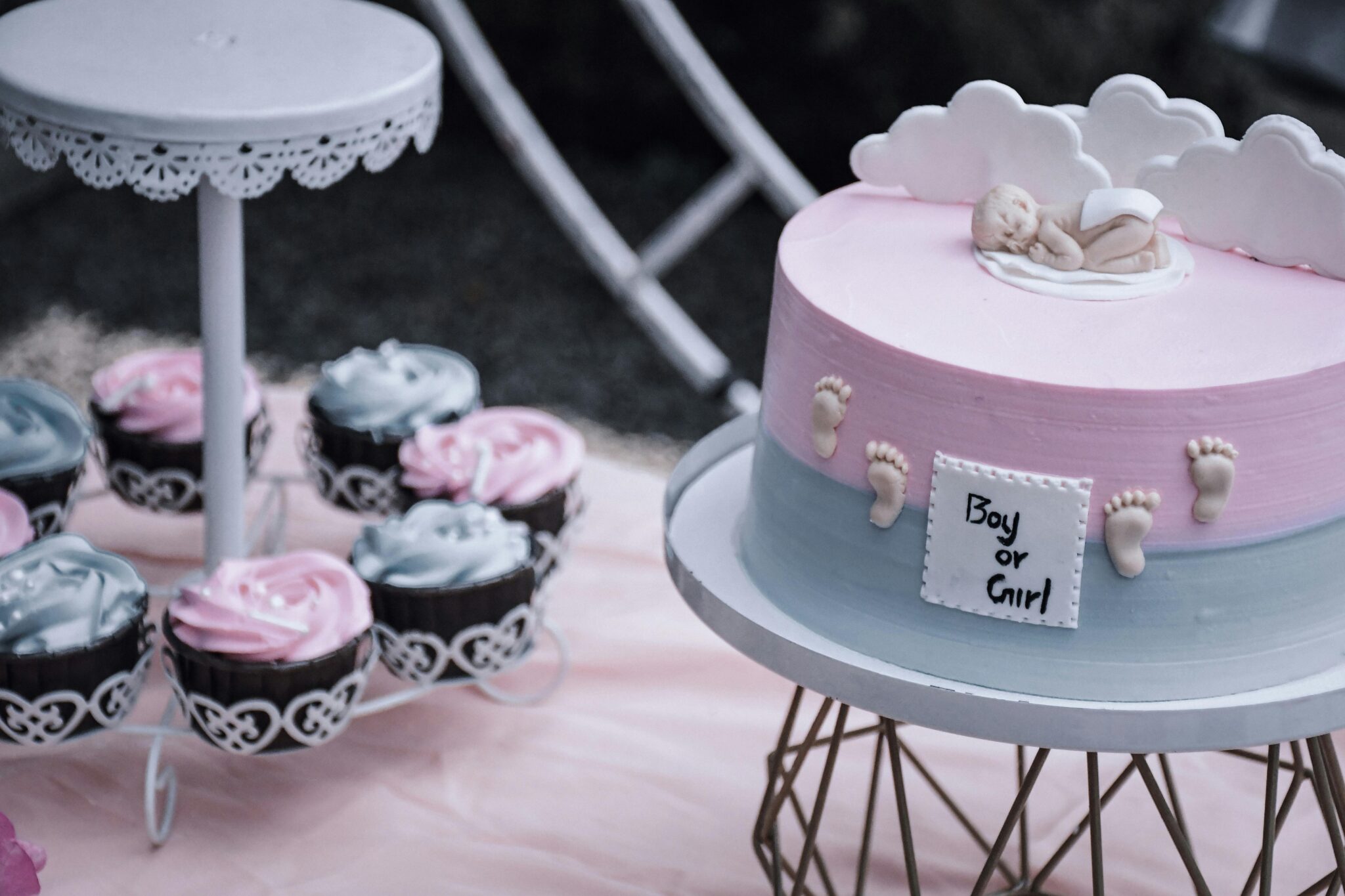 Gender Reveal cake and cupcakes with pink and blue icing