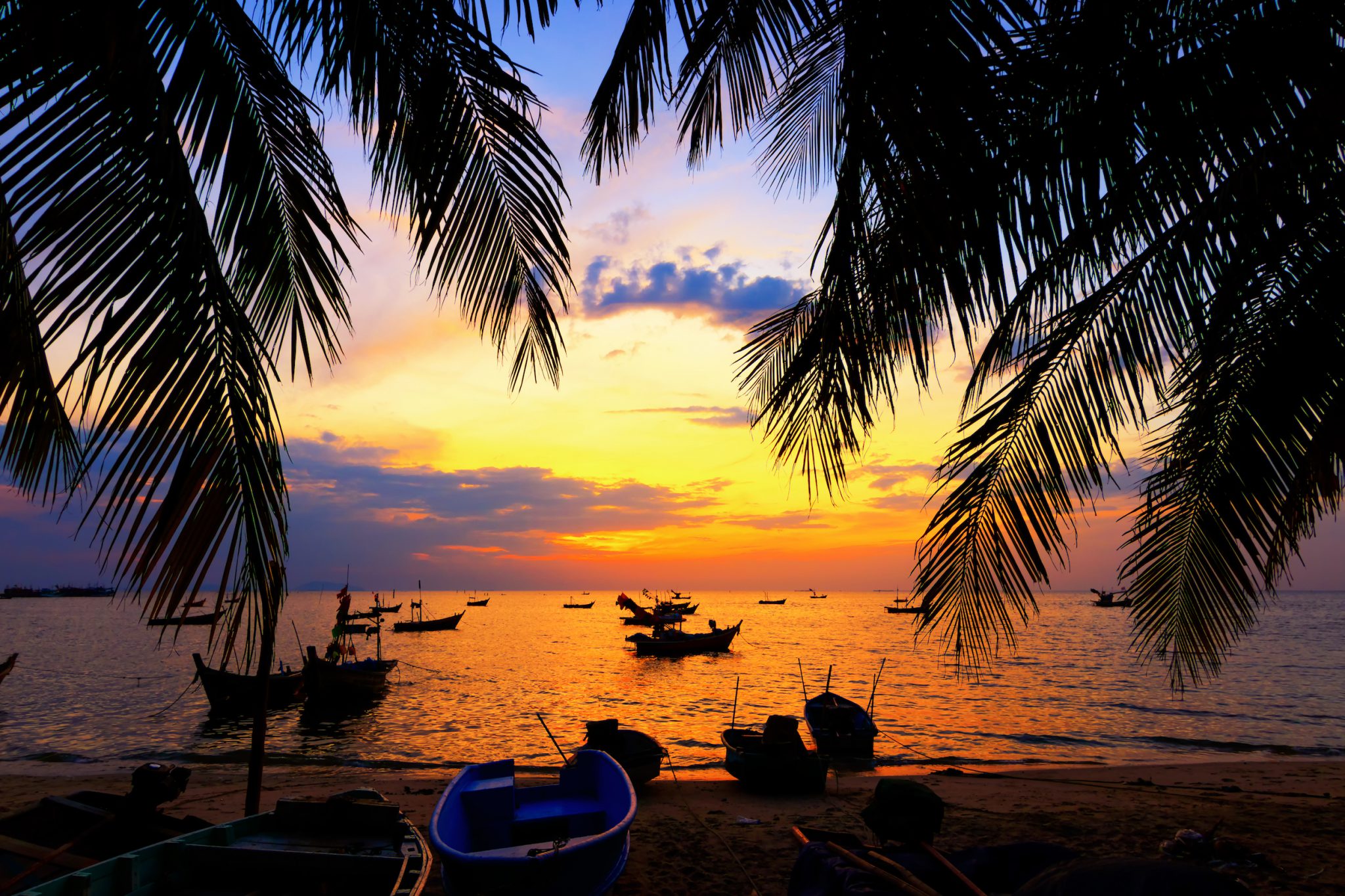 A sunset over a beach in Koh Tao, Thailand, one of the best free diving places in the world for marine life and beauty