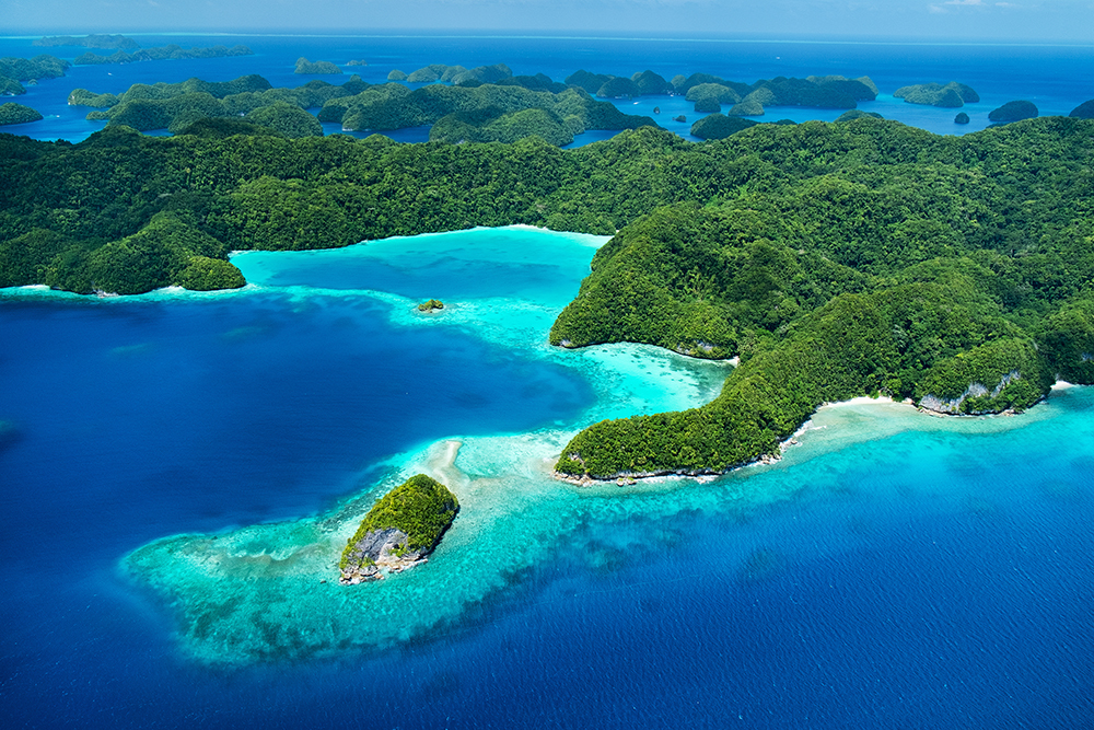 An aerial view of Palau, where crystal clear water and coral reefs provide some of the best scuba diving in January