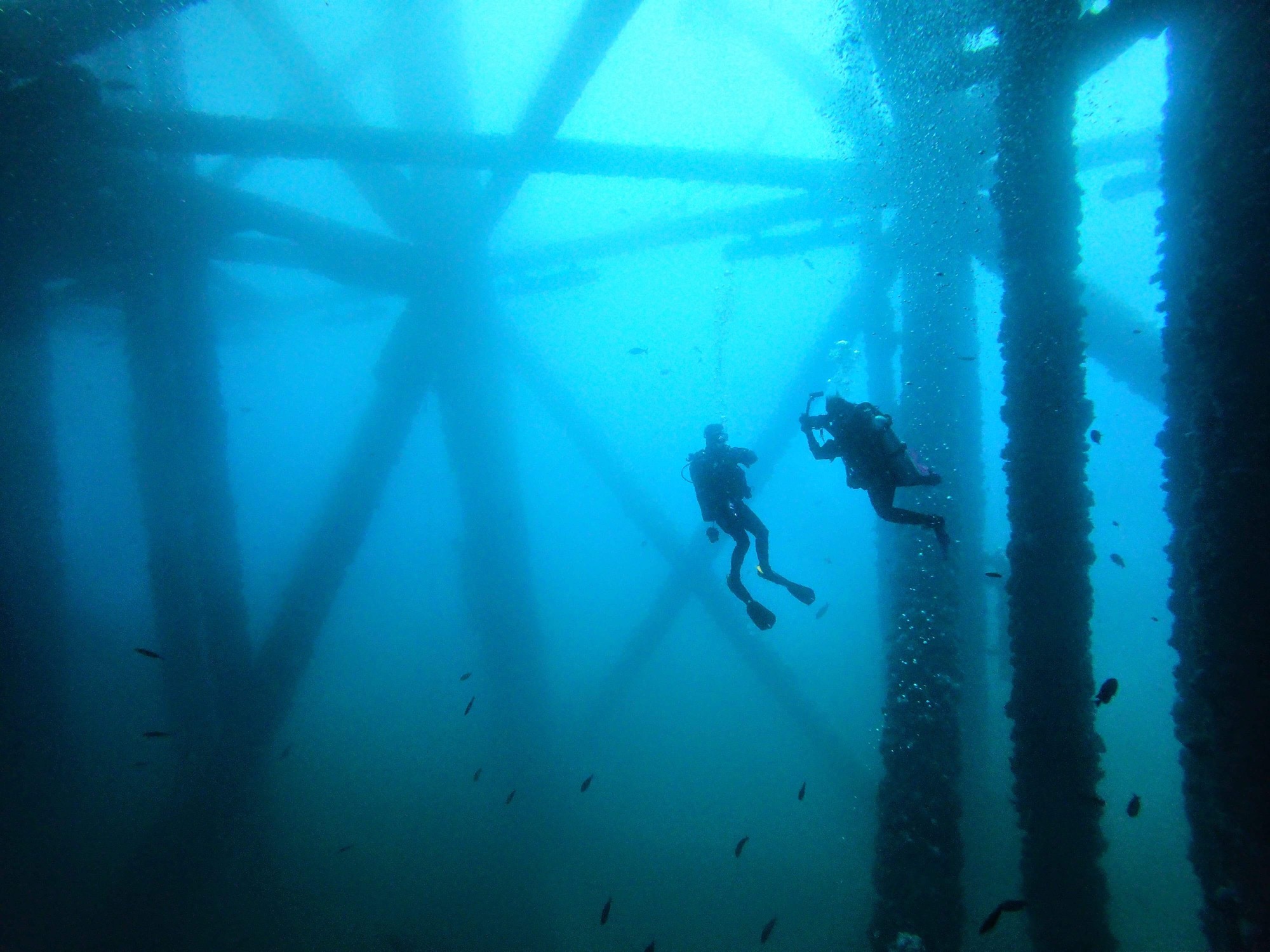 two divers on an oil rig california