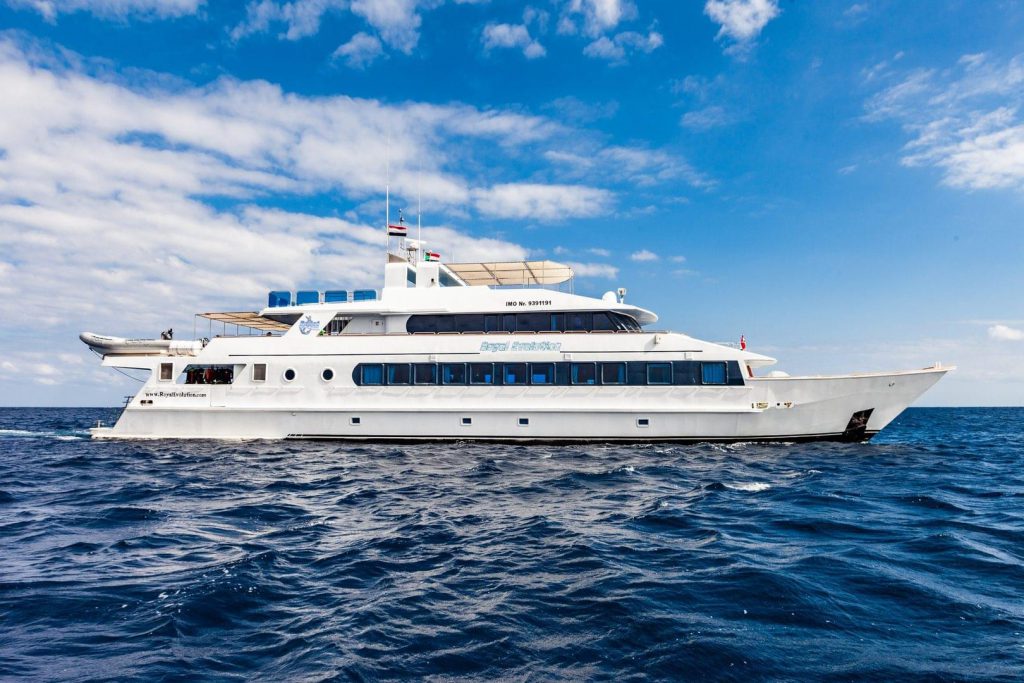 The MS Royal Evolution liveaboard shown on the water with a blue sky