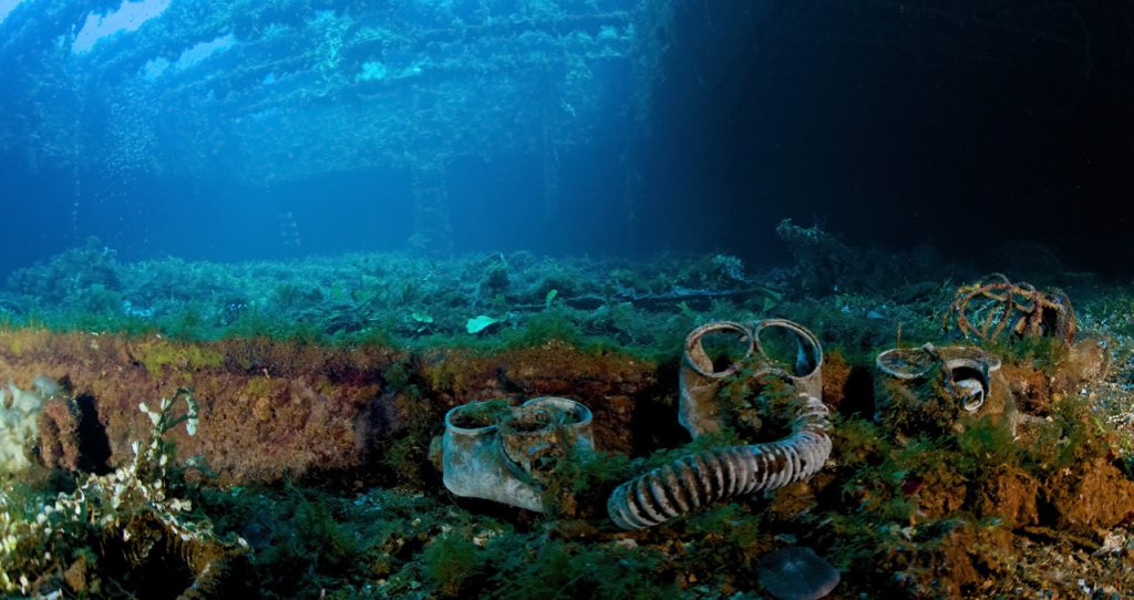 Three gas masks lying on the bottom of a World War II shipwreck in Truk Chuuk Lagoon Micronesia