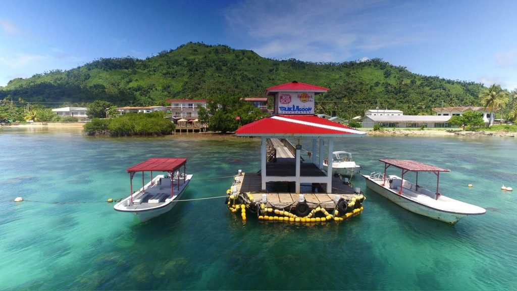 Two boats tied onto the jetty at the truk stop hotel in Chuuk Lagoon Micronesia