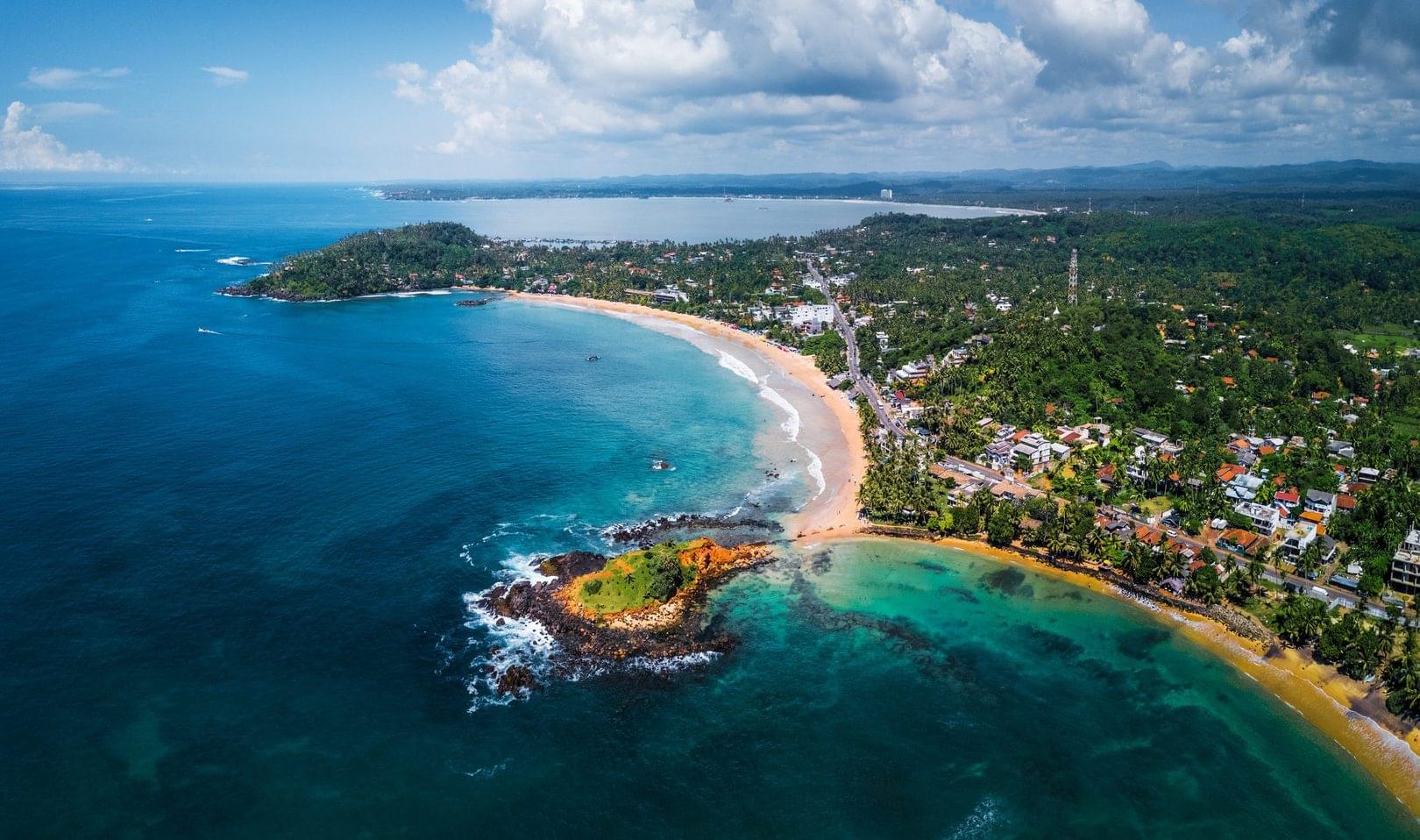 An aerial view of Mirissa Beach, one of the favorite diving places in Sri Lanka and a great place for blue whale encounters