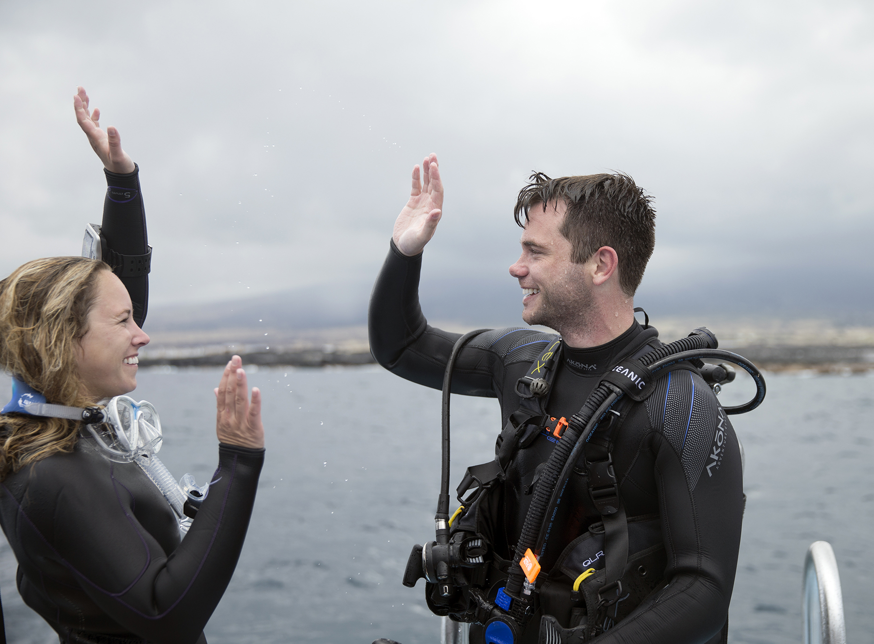 dive buddies high fives