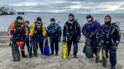 teenage scuba divers in drysuits