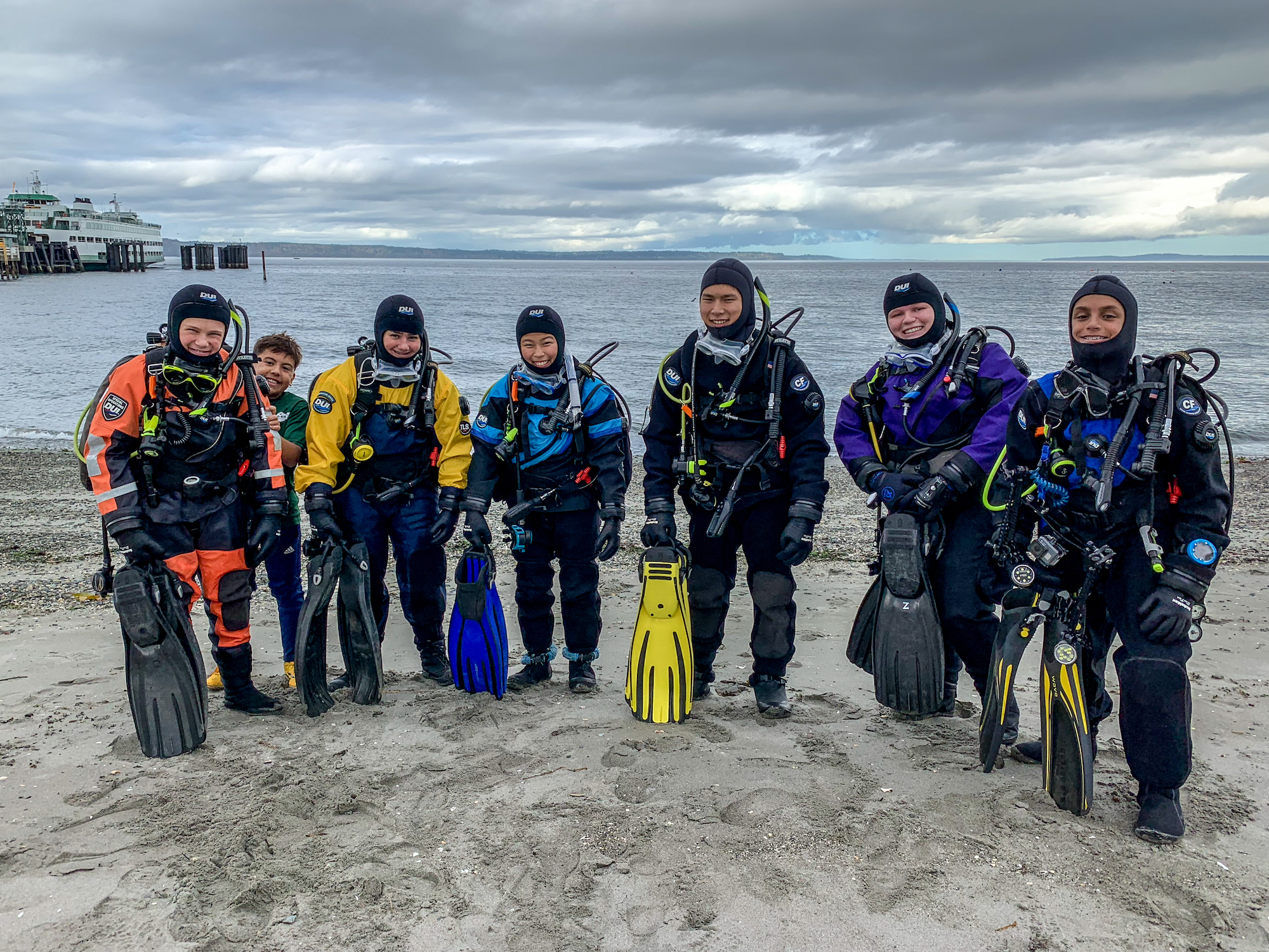 teenage scuba divers in drysuits