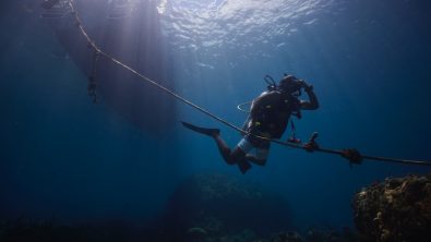 A diver descends along an anchor line