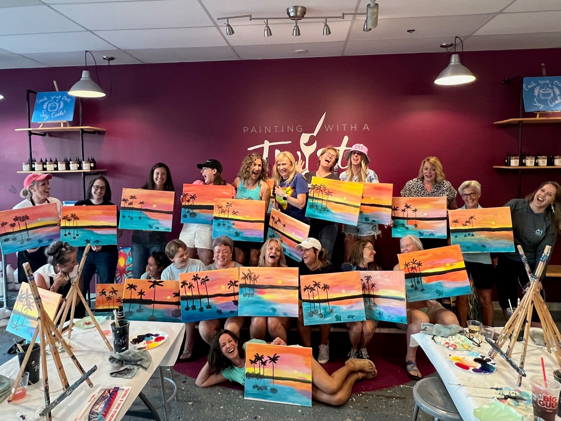 a group of women paint a water landscape at a women's dive day event in 2023