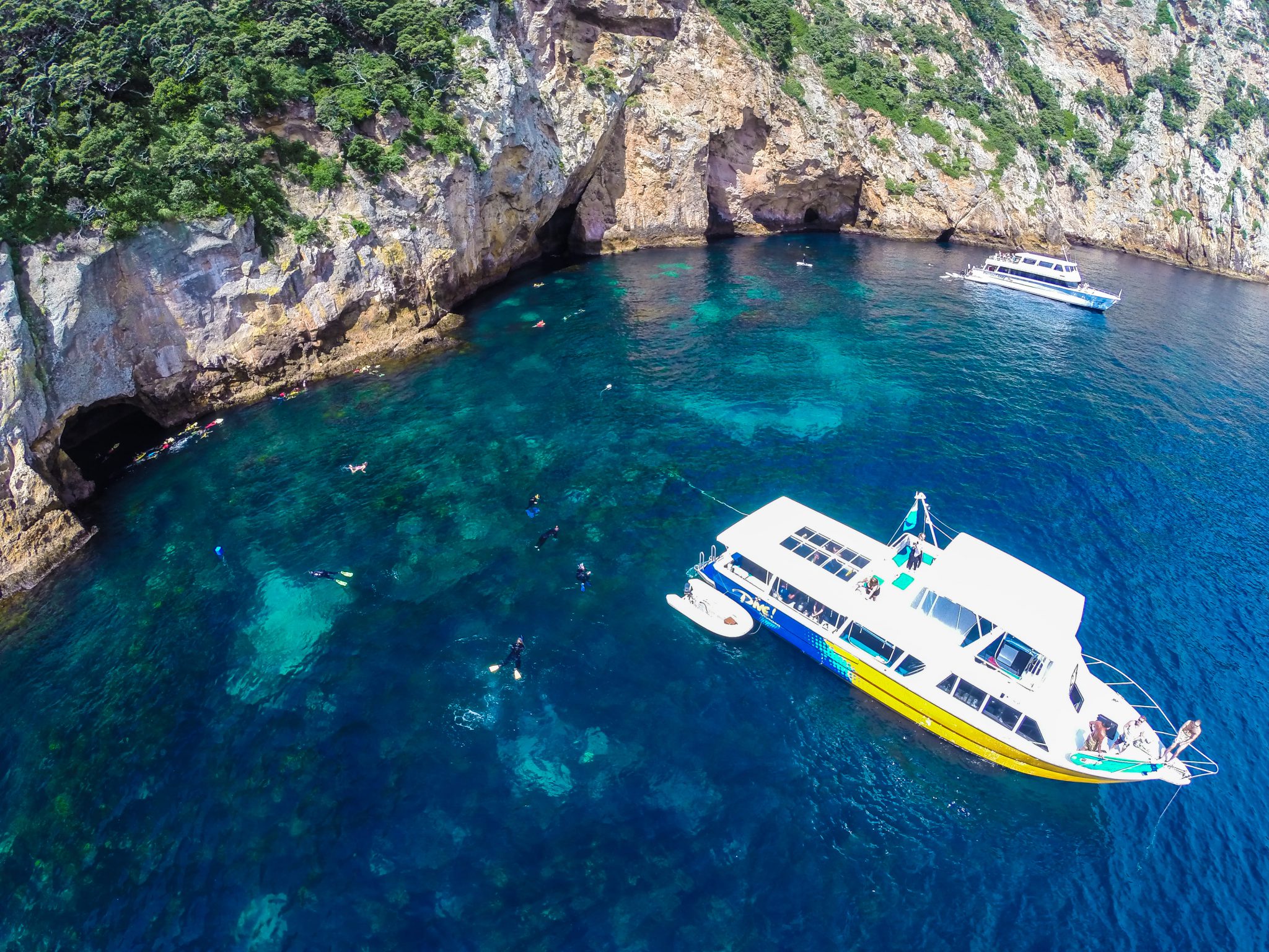 Dive boat with snorkelers in the water