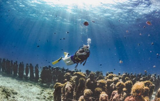 underwater sculptures of people at MUSA underwater museum