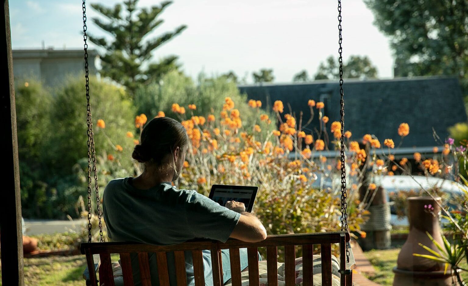 A PADI scuba diver student completing his PADI Open Water eLearning at home before finishing his PADI courses in the ocean