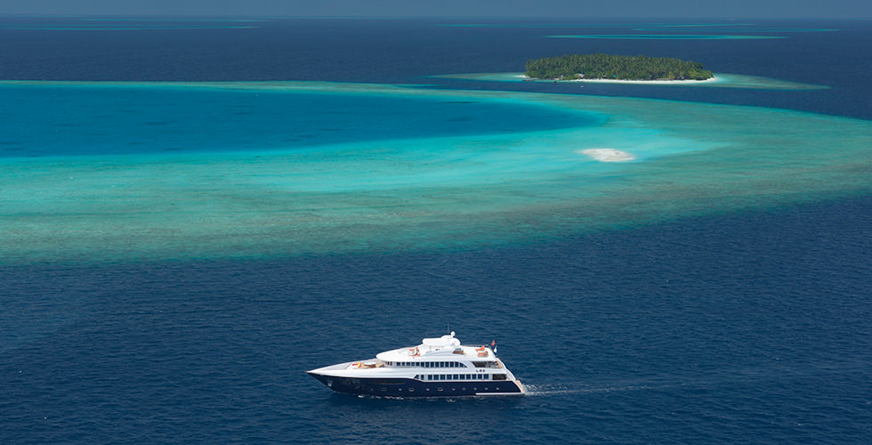A liveaboard sailing in the Maldives, which is an unforgettable destination to visit for your first liveaboard trip