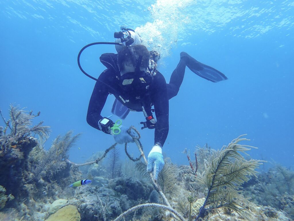 Fabien Cousteau removes rope from a Florida Keys reef.