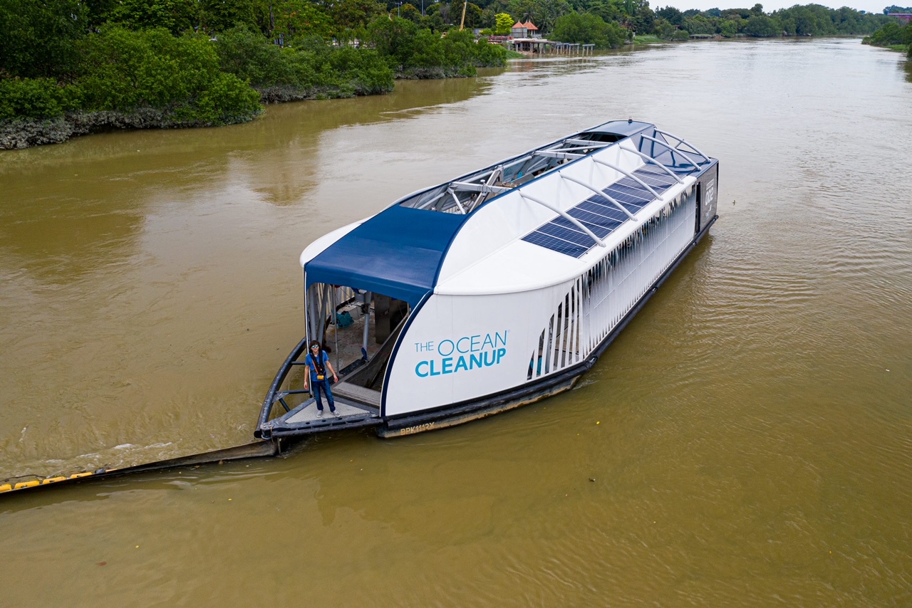 An interceptor designed by the ocean cleanup cleans a river in Malaysia