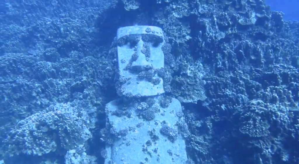 a moai statue underwater in the remote scuba diving location rapa nui also known as Easter Island