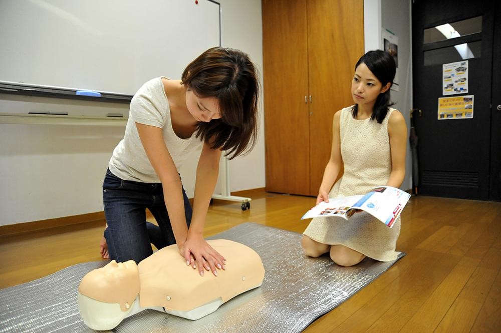 bls certificate student performing cpr on a dummy