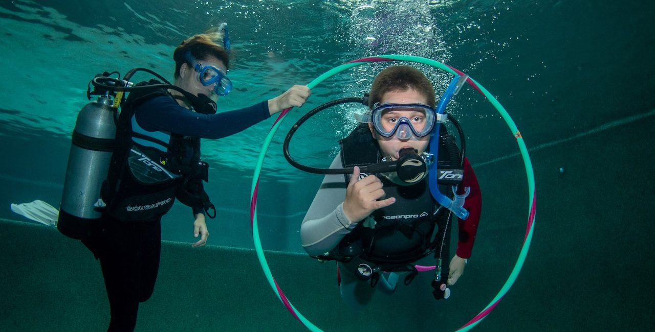 How Your Next Dive Trip Pays It Forward: PADI Dive Centers that Give Back to Local Communities