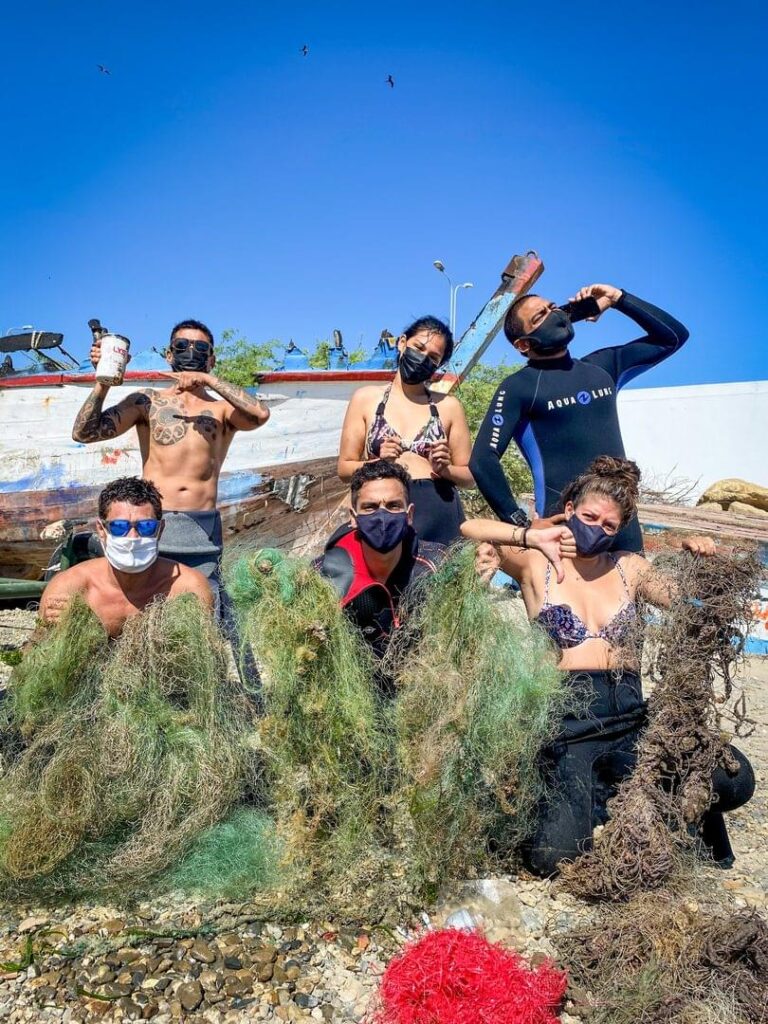 Divers collect ghost nets