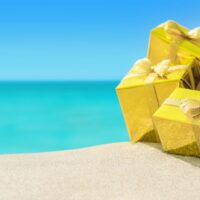 a tropical ocean with gift boxes in the foreground