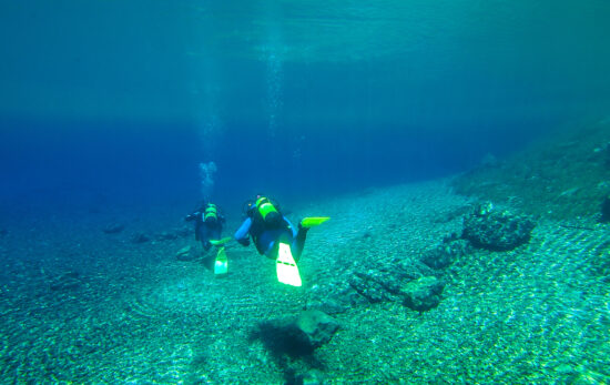 cristal clear waters with 2 divers