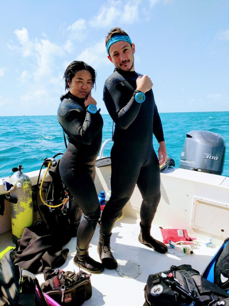 A woman and man diver accidentally coordinate their entire dive outfit