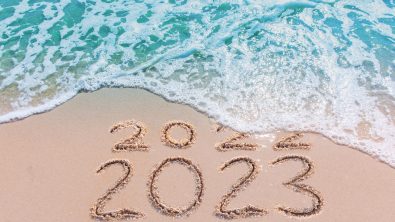 Message Year 2022 replaced by 2023 written on beach sand background. Good bye 2022 hello to 2023 happy New Year coming concept.